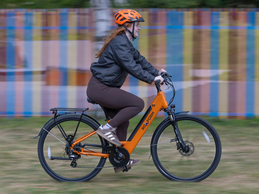 Rider on a Roxform city e-bike in motion on a UK road