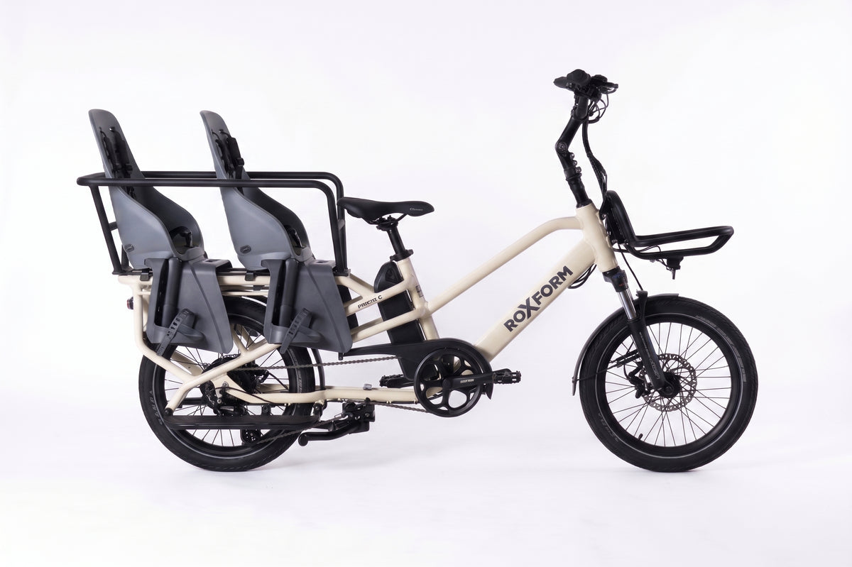 Roxform PORTO S electric longtail cargo bike in Cream, side view, fitted with the Family Pack caboose and two Urban Iki TA-KE child seats [addon:family-pack-caboose-footrest-without-cushion] [addon:rear-seat-ta-ke-carrier-mount-icho-green-bincho-black|2]